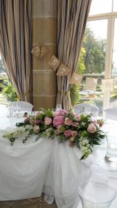 Top table wedding flowers by Rugeley Florist by Rugeley Floral Studio Fine Flowers for your Staffordshire Wedding