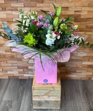 Supreme Deluxe Bouquet handtied with Lily, Green Blooms, Roses, Phlox, Lisianthus, Stocks and mixed foliages