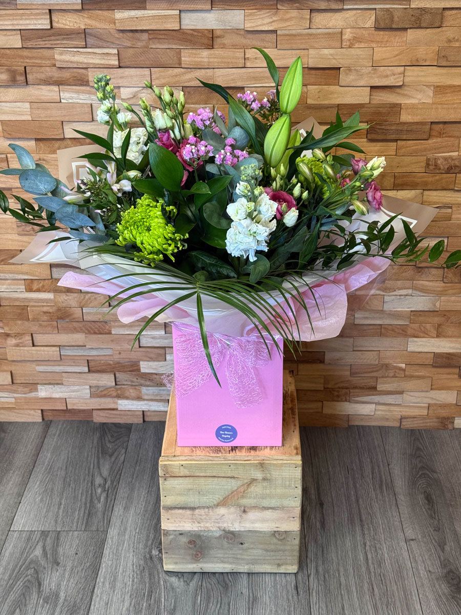 Supreme Deluxe Bouquet handtied with Lily, Green Blooms, Roses, Phlox, Lisianthus, Stocks and mixed foliages
