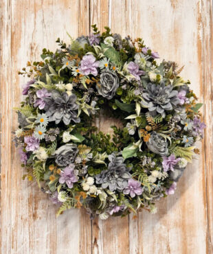 Coastal wreath featuring Roses, Dahliah, Blossom, Daisy, Grey Gypsophila, Mixed foliages including ferns and Eucalyptus.