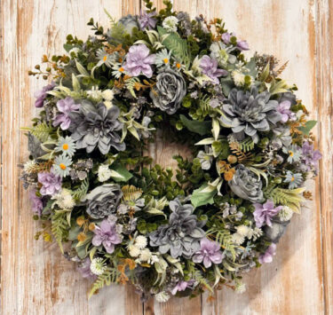 Coastal wreath featuring Roses, Dahliah, Blossom, Daisy, Grey Gypsophila, Mixed foliages including ferns and Eucalyptus.