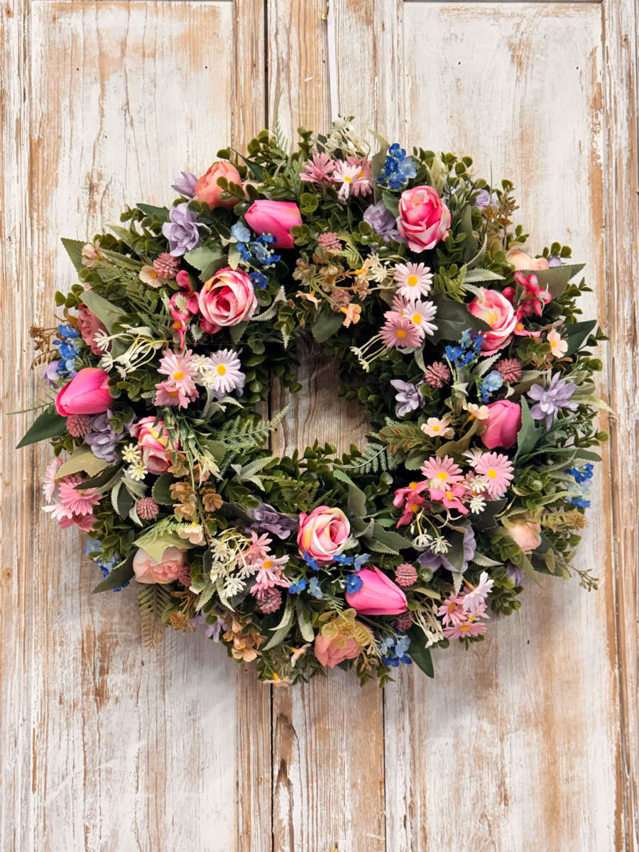 Daisy Wreath featuring Tulips, Roses, Daisys, Forget-me-not, Ranunculus, Mixed foliages including ferns and Eucalyptus.