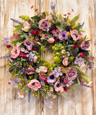 Enchanted Wreath featuring Anemones, Roses, Lavender, Ranunculus, Mixed foliages including ferns and Eucalyptus.