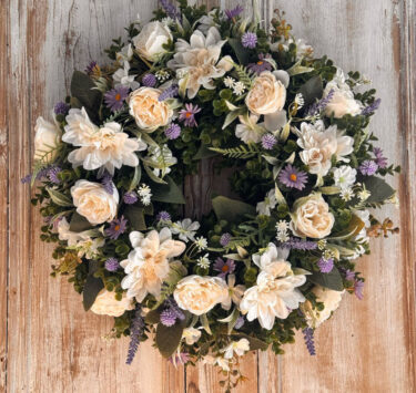 Heather Wreath featuring Roses, Dahlia, Daisy’s, Thistle, Lavender, Mixed foliages including ferns and Eucalyptus.