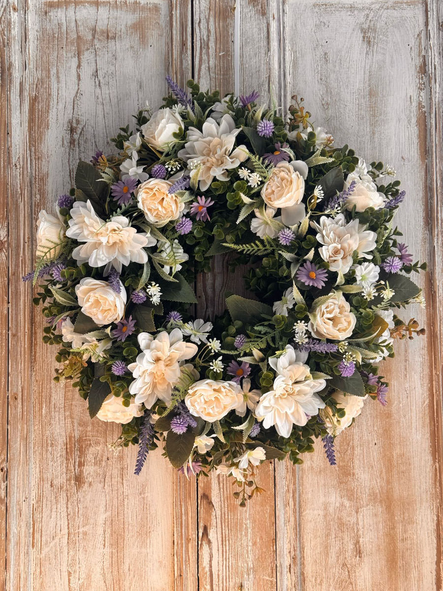 Heather Wreath featuring Roses, Dahlia, Daisy’s, Thistle, Lavender, Mixed foliages including ferns and Eucalyptus.