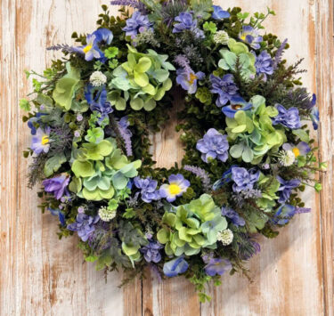 Lavender Wreath featuring Lavender, Hydrangeas, Cosmos, Iris, Heather, Delphinium buds, Mixed foliages including ferns and Eucalyptus.