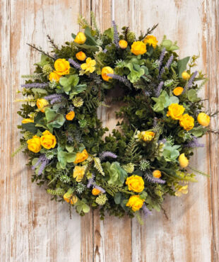 Coastal wreath featuring Yellow Roses, Ranunculus, Lavender, Heather, Mixed foliages including ferns and Eucalyptus.