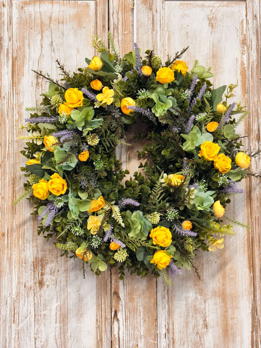 Coastal wreath featuring Yellow Roses, Ranunculus, Lavender, Heather, Mixed foliages including ferns and Eucalyptus.