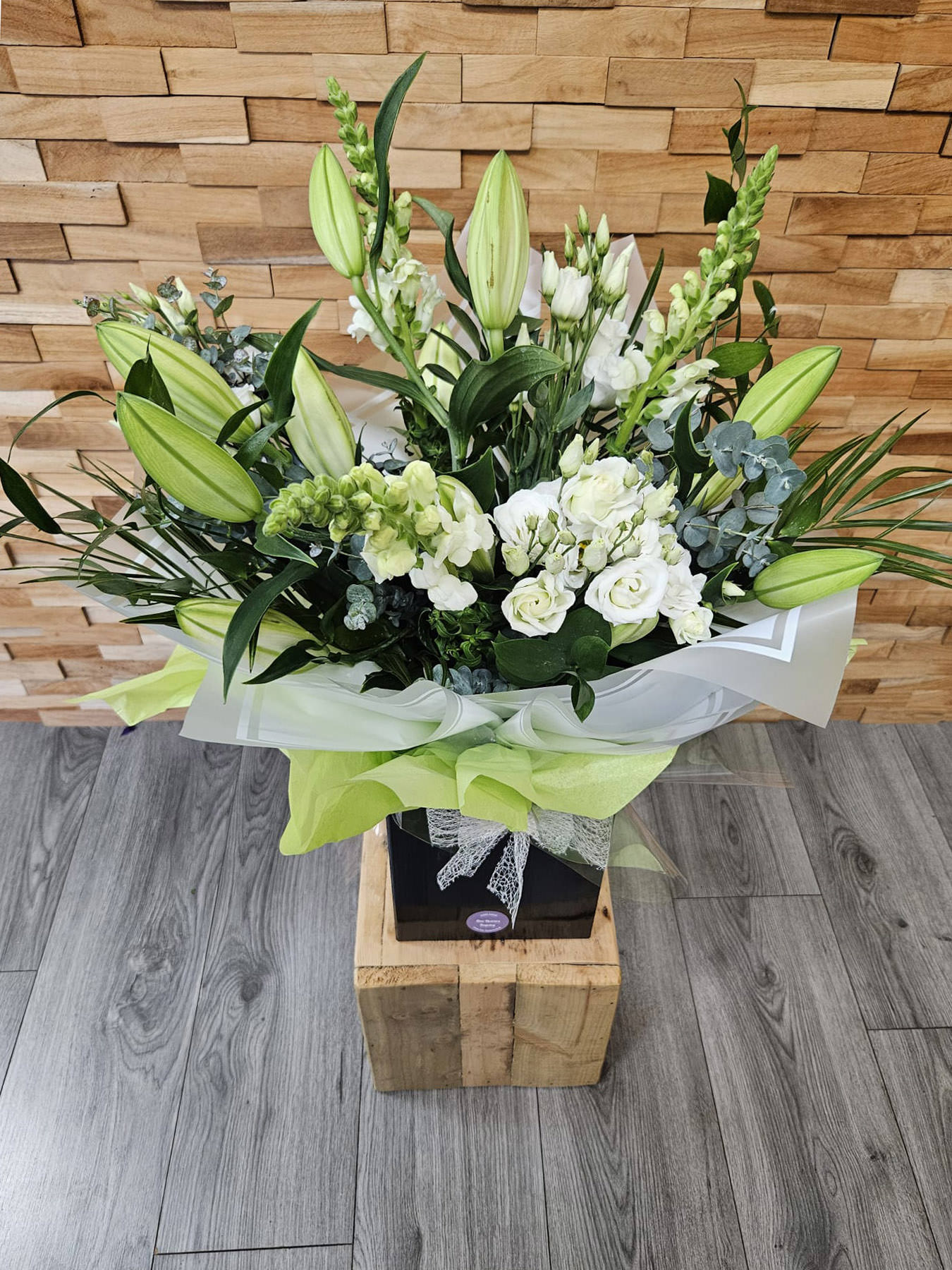Elegant Luxury White bouquet with lilies, lisianthus, and antirrhinum. Hand-tied, fresh, and delivered by Fine Flowers across Staffordshire.