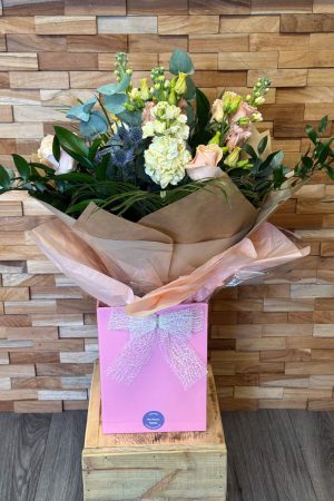 Handtied bouquet of Apricot Rose, Cream Stocks, Apricot Lisianthus, Blue Thistle. | Fresh Flowers from Fine Flowers